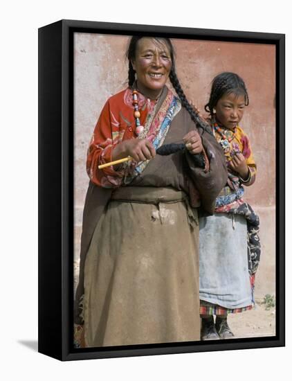 Tibetan Woman Spinning, Qinghai Province, China-Occidor Ltd-Framed Stretched Canvas