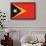 Timor-Leste Flag Design with Wood Patterning - Flags of the World Series-Philippe Hugonnard-Framed Art Print displayed on a wall