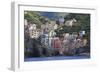 Tiny harbour and medieval houses in steep ravine, Riomaggiore, UNESCO World Heritage Site, Italy-Eleanor Scriven-Framed Photographic Print