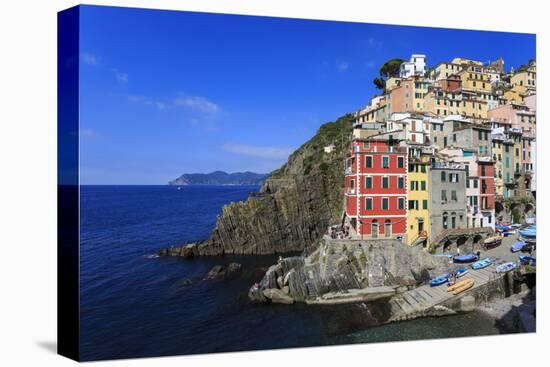 Tiny harbour and medieval houses in steep ravine, Riomaggiore, UNESCO World Heritage Site, Italy-Eleanor Scriven-Stretched Canvas