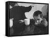 Tired Child is Ready to Go to Sleep with His Head on the Dining Room Table at Ellis Island-Alfred Eisenstaedt-Framed Stretched Canvas