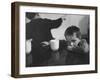 Tired Child is Ready to Go to Sleep with His Head on the Dining Room Table at Ellis Island-Alfred Eisenstaedt-Framed Photographic Print