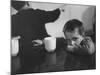 Tired Child is Ready to Go to Sleep with His Head on the Dining Room Table at Ellis Island-Alfred Eisenstaedt-Mounted Photographic Print