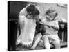 Toddler Trying to Brush Dog's Teeth-null-Stretched Canvas