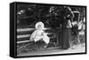 Toddler with Nanny or Mother on a Park Bench, Ca. 1900-null-Framed Stretched Canvas