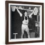 Tommy Kono Winning the Gold Medal for Men's Weightlifting at the 1956 Melbourne Olympics-null-Framed Photographic Print