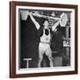 Tommy Kono Winning the Gold Medal for Men's Weightlifting at the 1956 Melbourne Olympics-null-Framed Photographic Print