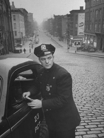 Ny Patrolman James Murphy Standing by His 23 Precinct Squad Car on Street of His East Harlem Beat