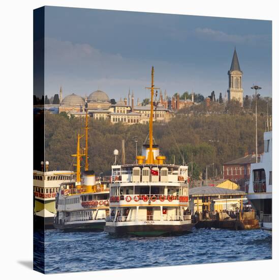 Topkapi Palace and Ferries on the Waterfront of the Golden Horn, Istanbul, Turkeyistanbul, Turkey-Jon Arnold-Stretched Canvas