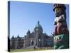 Totem Pole and Parliament Building, Victoria, Vancouver Island, British Columbia, Canada, North Ame-Martin Child-Stretched Canvas