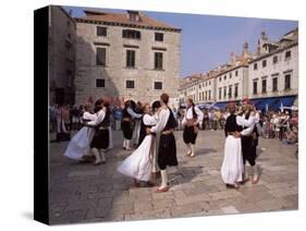 Tourist Board Folk Dancers in Lusa Square, Dubrovnik, Dalmatia, Croatia-Peter Higgins-Stretched Canvas