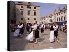 Tourist Board Folk Dancers in Lusa Square, Dubrovnik, Dalmatia, Croatia-Peter Higgins-Stretched Canvas