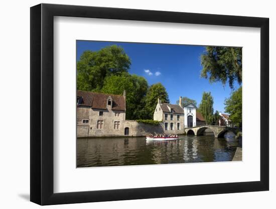 Tourist boat, at the Minnewater Lake and Begijnhof Bridge with entrance to Beguinage, Bruges, Belgi-Peter Barritt-Framed Photographic Print