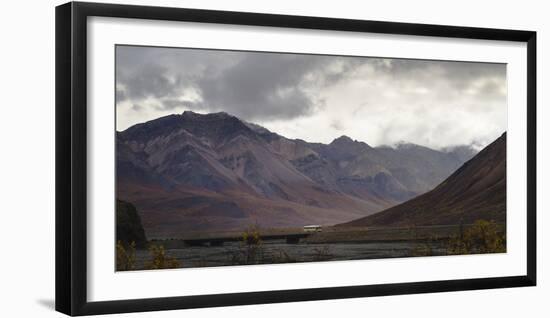 Tourist bus driving among mountains in the Denali National Park, Alaska, United States of America, -JIA JIAHE-Framed Photographic Print