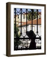 Tourist Gazes at Historic House through Iron Grillwork of Church, Lisbon, Portugal-Merrill Images-Framed Photographic Print