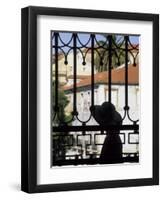 Tourist Gazes at Historic House through Iron Grillwork of Church, Lisbon, Portugal-Merrill Images-Framed Premium Photographic Print