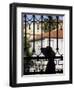 Tourist Gazes at Historic House through Iron Grillwork of Church, Lisbon, Portugal-Merrill Images-Framed Premium Photographic Print