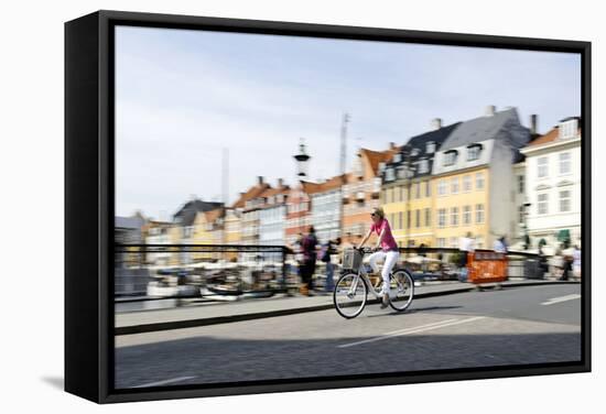 Tourist on Bicycle, Entertainment District, Nyhavn, Copenhagen, Scandinavia-Axel Schmies-Framed Stretched Canvas