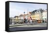 Tourist on Bicycle, Entertainment District, Nyhavn, Copenhagen, Scandinavia-Axel Schmies-Framed Stretched Canvas