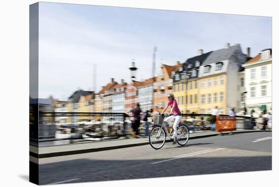 Tourist on Bicycle, Entertainment District, Nyhavn, Copenhagen, Scandinavia-Axel Schmies-Stretched Canvas