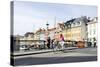 Tourist on Bicycle, Entertainment District, Nyhavn, Copenhagen, Scandinavia-Axel Schmies-Stretched Canvas