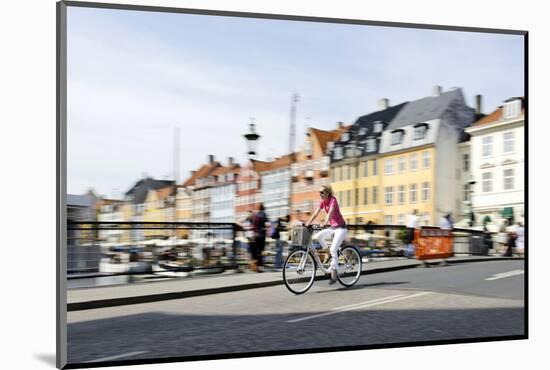 Tourist on Bicycle, Entertainment District, Nyhavn, Copenhagen, Scandinavia-Axel Schmies-Mounted Photographic Print