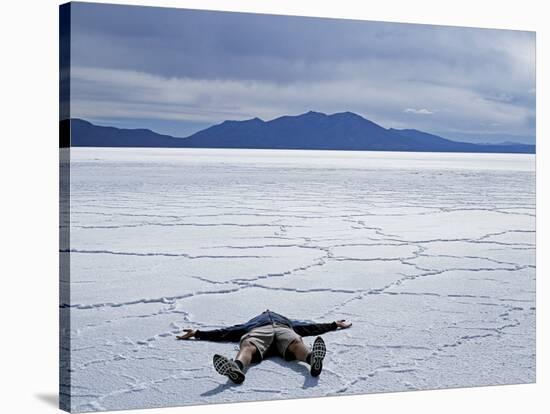 Tourist on Salt Crust of Salar De Uyuni, Emphasising Scale of Largest Salt Flat in World, Bolivia-John Warburton-lee-Stretched Canvas