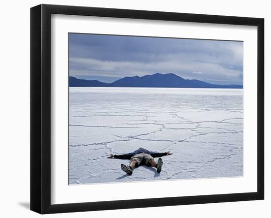 Tourist on Salt Crust of Salar De Uyuni, Emphasising Scale of Largest Salt Flat in World, Bolivia-John Warburton-lee-Framed Photographic Print