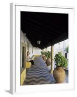 Tourist on Terrace with Striped Cobblestone Floor and Planters, Portugal-Merrill Images-Framed Photographic Print