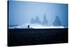 Tourist running on Black Sand Beach, Iceland, Polar Regions-John Alexander-Stretched Canvas