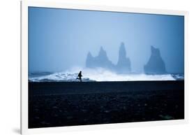 Tourist running on Black Sand Beach, Iceland, Polar Regions-John Alexander-Framed Photographic Print