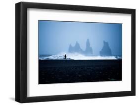 Tourist running on Black Sand Beach, Iceland, Polar Regions-John Alexander-Framed Photographic Print