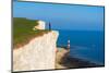 Tourist stands on top of the cliff overlooking Beachy Head lighthouse, Seven Sisters chalk cliffs-Paolo Graziosi-Mounted Photographic Print