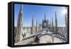 Tourists among the white marble spiers on the top of the Duomo, Milan, Lombardy, Italy, Europe-Roberto Moiola-Framed Stretched Canvas