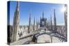 Tourists among the white marble spiers on the top of the Duomo, Milan, Lombardy, Italy, Europe-Roberto Moiola-Stretched Canvas