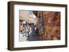 Tourists and Locals Walking Alongside Traditional Rugs in the Medina's Souks-Charlie Harding-Framed Photographic Print