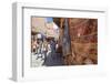 Tourists and Locals Walking Alongside Traditional Rugs in the Medina's Souks-Charlie Harding-Framed Photographic Print