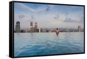 Tourists at infinity pool of Marina Bay Sands Hotel, Marina Bay, Singapore-null-Framed Stretched Canvas