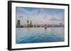 Tourists at infinity pool of Marina Bay Sands Hotel, Marina Bay, Singapore-null-Framed Photographic Print