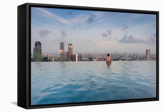 Tourists at infinity pool of Marina Bay Sands Hotel, Marina Bay, Singapore-null-Framed Stretched Canvas