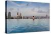 Tourists at infinity pool of Marina Bay Sands Hotel, Marina Bay, Singapore-null-Stretched Canvas