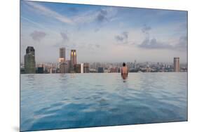 Tourists at infinity pool of Marina Bay Sands Hotel, Marina Bay, Singapore-null-Mounted Photographic Print