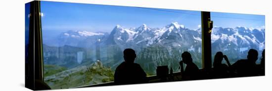 Tourists at Schilthorn 007 Restaurant with Mt Eiger Mt Monch Mt Jungfrau in the Background-null-Stretched Canvas