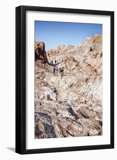 Tourists Climbing over the Top of Chulacao Caves, Moon Valley, Atacama Desert-Kimberly Walker-Framed Photographic Print