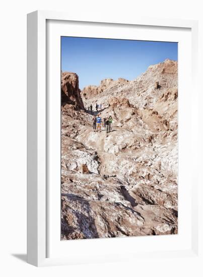 Tourists Climbing over the Top of Chulacao Caves, Moon Valley, Atacama Desert-Kimberly Walker-Framed Photographic Print