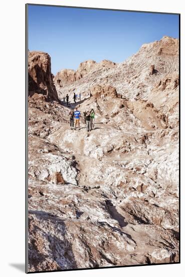 Tourists Climbing over the Top of Chulacao Caves, Moon Valley, Atacama Desert-Kimberly Walker-Mounted Photographic Print