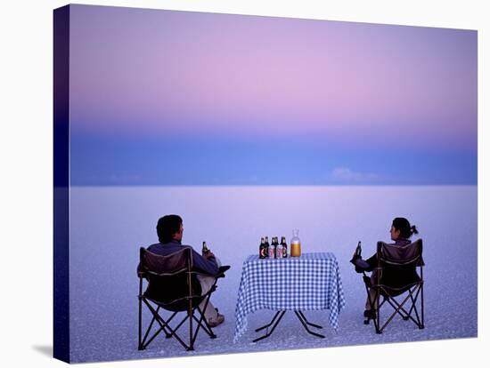 Tourists Enjoy Sundowners While Looking Out across the Endless Salt Crust of Salar De Uyuni-John Warburton-lee-Stretched Canvas