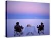Tourists Enjoy Sundowners While Looking Out across the Endless Salt Crust of Salar De Uyuni-John Warburton-lee-Stretched Canvas
