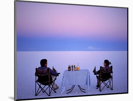 Tourists Enjoy Sundowners While Looking Out across the Endless Salt Crust of Salar De Uyuni-John Warburton-lee-Mounted Photographic Print