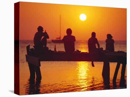 Tourists Enjoying the Sunset, Roatan, Largest of the Bay Islands, Honduras, Caribbean Sea-Robert Francis-Stretched Canvas